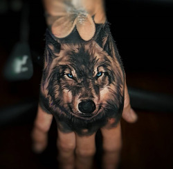 tattooideas123:  Wolf Hand Tattoohttp://tattooideas247.com/wolf-hand-tattoo/  LONEWOLF