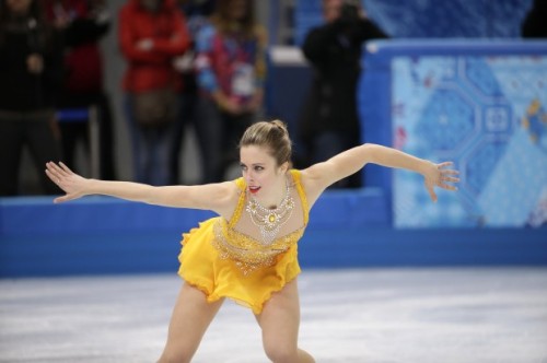 NOW THAT’S WHAT WE CALL BLING! Ashley Wagner brings the bling on in this marigold in her Samso