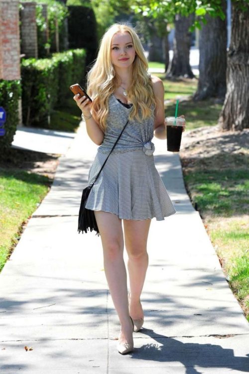 hot-miniskirts: Gorgeous Dove Cameron out and about, wearing a cute mini skirt and tied top. Adorabl