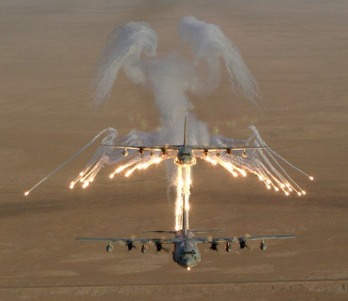 sharethyknowledge:  The Smoke Angels. Wingtip vortices shown in flare smoke left behind a C-17 Globe