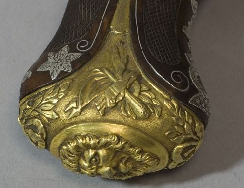 art-of-swords:  Pistol Dagger Dated: circa 1850 Culture: British (manufactured for the Orient) The weapon has round faceted barrels with lugs, gilt engraved and decorated, and marked ‘London’. The swan neck plate and hammer have a flat body, while