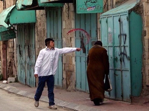 fivemoreminutesofsleep:  the-poets-daughter:  victorious-musliims:  abu-saifuddin:  Jew throwing wine over a helpless palestinian muslimah  Look who the real terrorists are!  Don’t they ever think that this is what happened to them a while back let