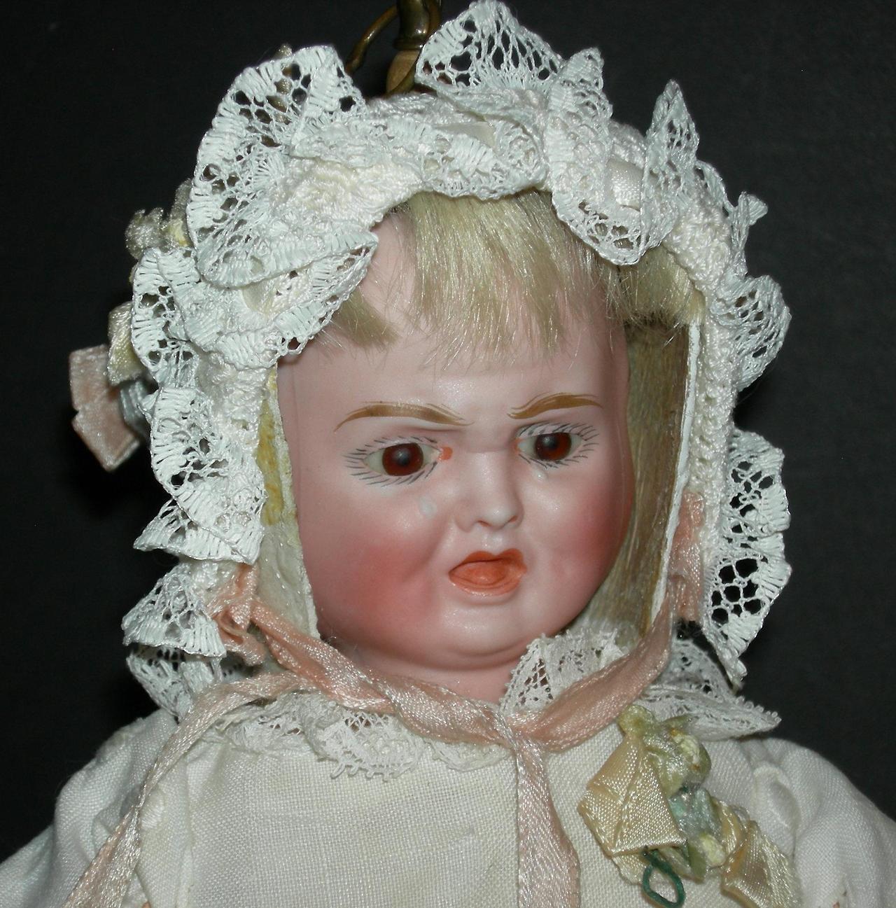 antique three faced doll