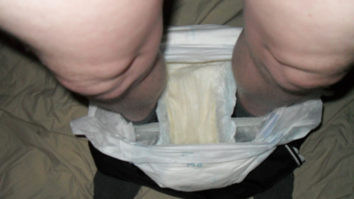 Wet diapers in my plastic pants round my ankles then just plastic pants ready to be pulled up over m