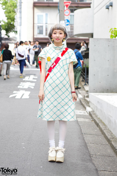 19-year-old Yuka on the street in Harajuku with a cute resale dress, white tights, a Marimekko bag a