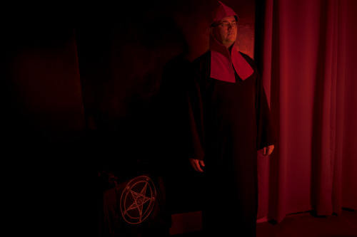 A member of the Satanic Thulian Society wearing the Tau Robes and headdress of Ordo Templi Orientis 