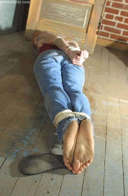 zippo077:  Abducted off the street and kept in a grimy warehouse before being shipped overseas, Katherine makes a desperate attempt to escape. In her struggles she  only succeeds in losing her flip flops and getting filthy from rolling around on the