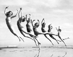 aw-ol:  dancers trained by Lillian Newman staging an outdoor tableux on the ocean front at Long Beach, California, March 16, 1934