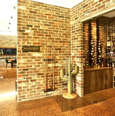 Medium Sydney Ideas For A Mid-sized, Modern Wine Cellar Renovation With Storage Racks That Has A Brown