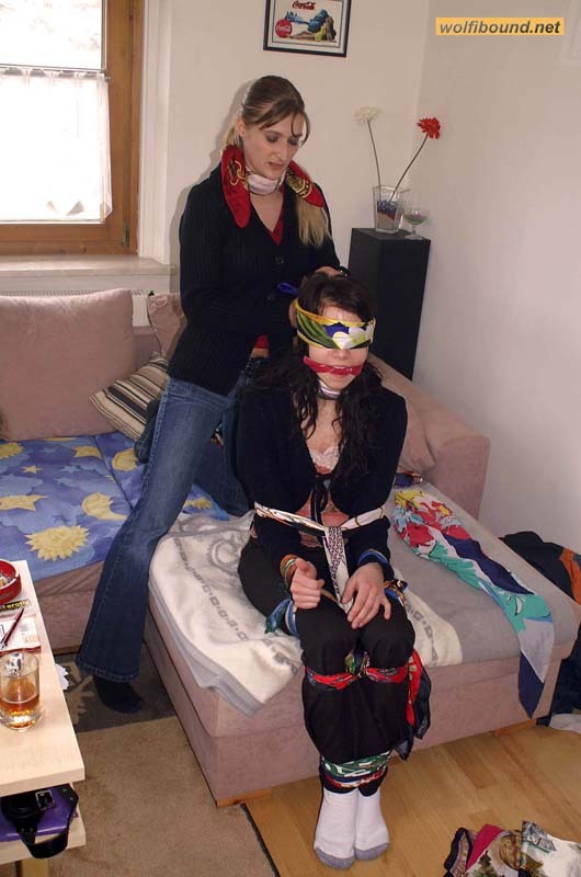 graybandanna:  Tying up her friend before joining her in scarf bondage