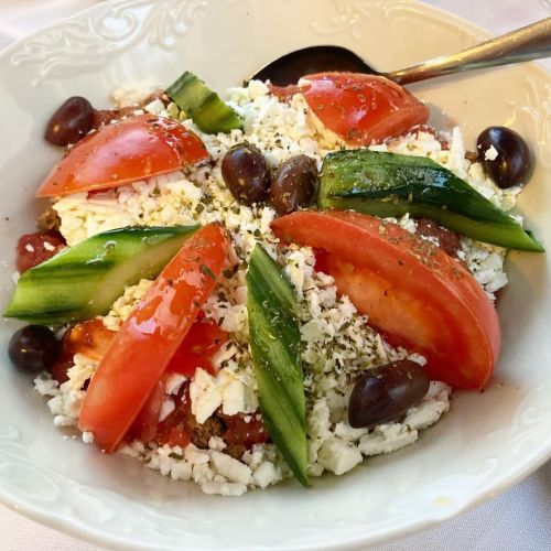 Tetradio salad with Cretan bakery cracker, tomato, cucumber, olives, feta cheese, oregano, olive oil