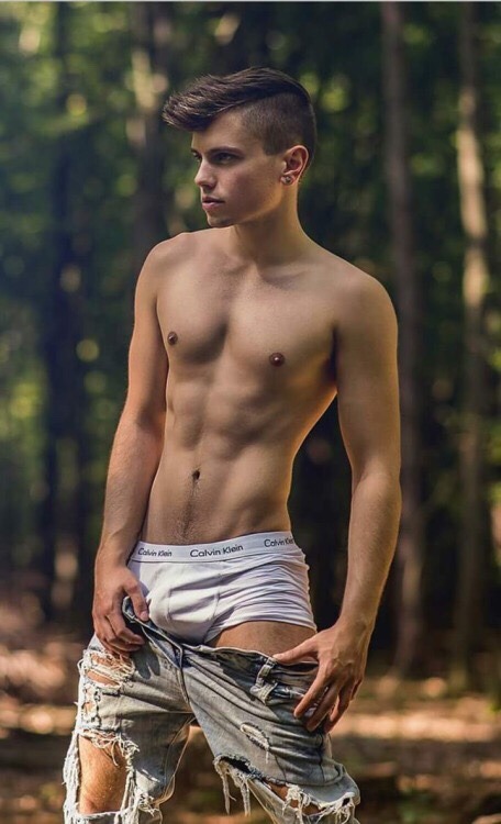 sebastianshomme: A young shirtless man with his ripped pants down in middle of a