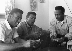 imransuleiman: Ali plays cards with his father and brother in 1963.
