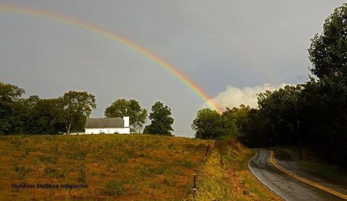 A rainbow arches over a rural church, after an evening&rsquo;s rain showers in Jefferson County.
