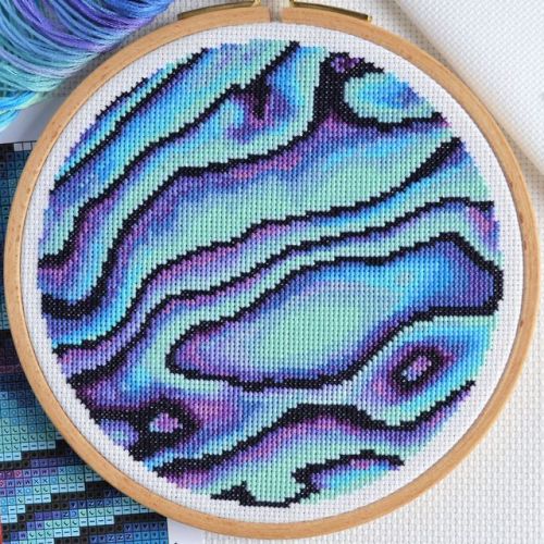 A Paua Shell cross stitch in a 6-inch hoop.