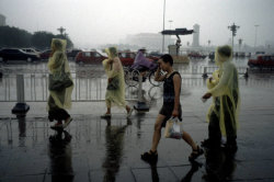 20aliens:   CHINA. Beijing. Tiananmen Square during a particularly heavy summer rainstorm that lasted for a whole afternoon. 1998. By Stuart Franklin 