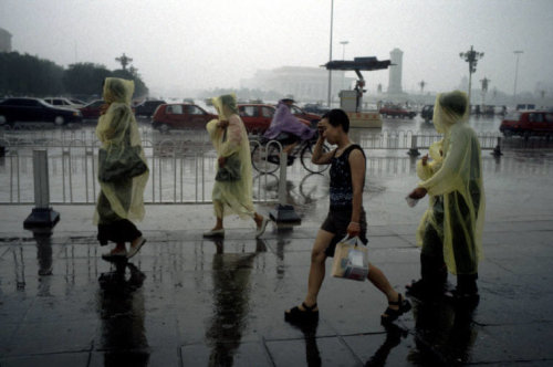 lesbianslovesatan:  20aliens:  CHINA. Beijing. Tiananmen Square during a particularly heavy summer rainstorm that lasted for a whole afternoon. 1998. By Stuart Franklin   +