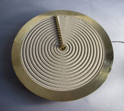 really-shit:  The Sand Clock, Studio AyaskanStudio Ayaskan’s sand clock rakes across a bed of sand, leaving ripples in the sand to represent each hour of the day. The purpose isn’t so much about accuracy, but an inventive reflection of the ephemeral