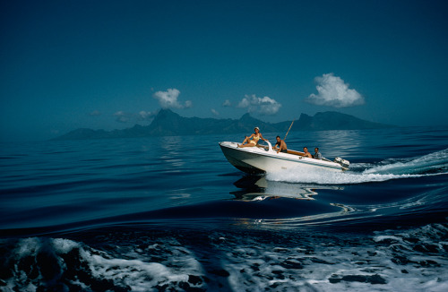 A motorboat carries tourists to fishing grounds off Tahiti, July 1962.Photograph by Luis Marden, Nat