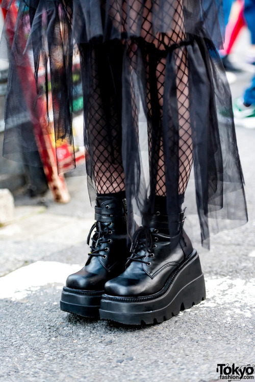 Chamafu on the street in Harajuku wearing a crossbody bag by the Japanese streetwear brand M.Y.O.B. NYC over a Dispark j