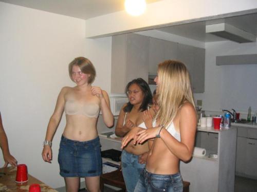 A wonderful embarrassed strip beer pong game, with a large group of cute girls getting down to their