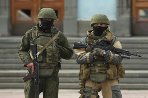 gunrunnerhell:  The Russians Heavily-armed soldiers without identifying insignia guard the Crimean parliament building after taking up positions there earlier in the day on March 1, 2014 in Simferopol, Ukraine. The soldiers’ arrival comes the day after