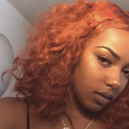 jojordan:       auburn hair on brown skin  