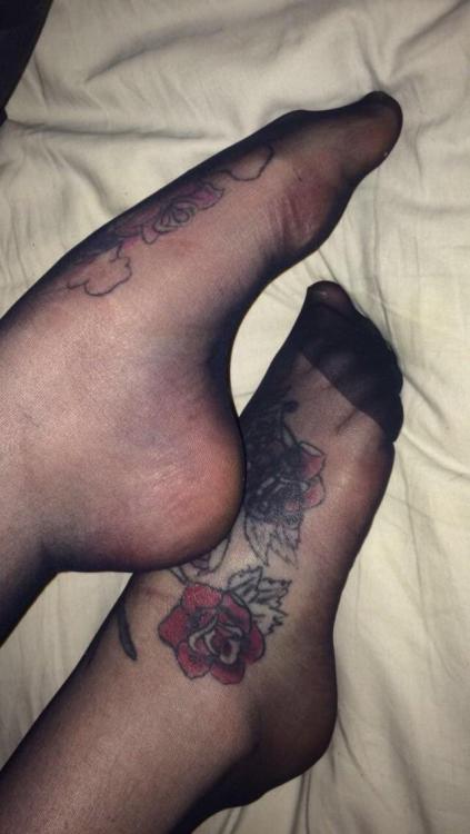 My tattooed stockinged feet Who wants to take them off with their teeth ?