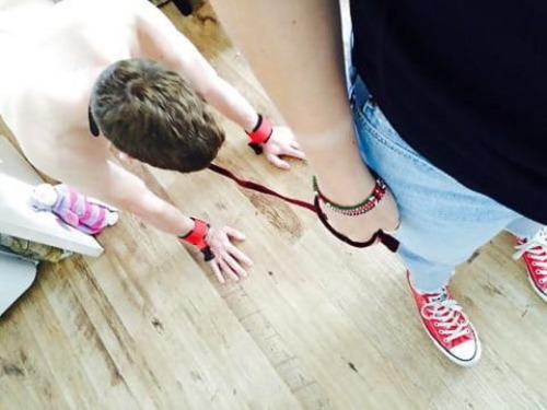 lead, leash, red converses, Femdom on point.  what else could a beta male need or want?