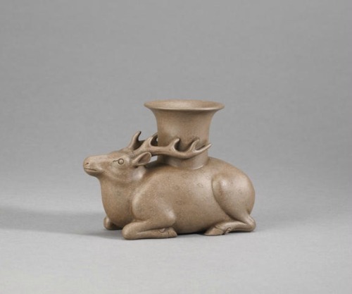 A very rare Yixing stoneware archaistic &lsquo;recumbent deer&rsquo; vessel and &l