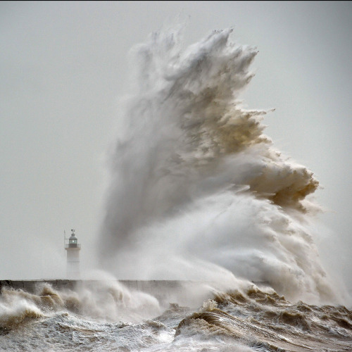 theeconomist: Waves crash over Newhaven Lighthouse on the south coast of England, as the latest stor