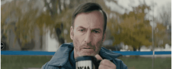 Bob Odenkirk as Hutch Mansell in Nobody drinking from a mug of coffee. 