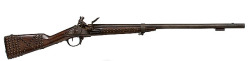 peashooter85:  A french flintlock musket which has been sawn off and Native American tack decorated, early 19th century.