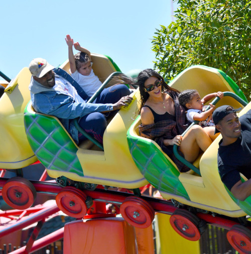 celebsofcolor: Kanye West, Kim Kardashian and North West in Disneyland