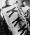 seymour-butz-stuff:tontonmichel-deactivated2022021:ebonytruth:Charles Warriax and Simeon Oxendine, both members of the Lumbee tribe of North Carolina, pose triumphantly with a KKK flag they seized during the Battle of Hayes Pond.In 1958, the Ku Klux Klan