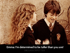 welcometotheapocalypse-horseman:  kaeandlucy:  byebyebananas:  i-am-fangirl-hear-me-squeal:  this is the most adorable thing i have ever seen   ”I’m determined to be taller than you are”  determination will get you anywhere  it’s hermione fucking