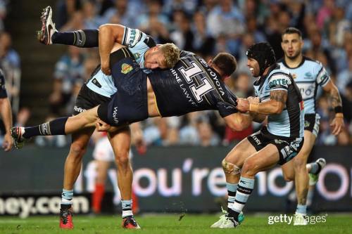 Tackle or tug of war? #NorthQueensland&rsquo;s Gavin Cooper is pulled down during the Cowboys&am