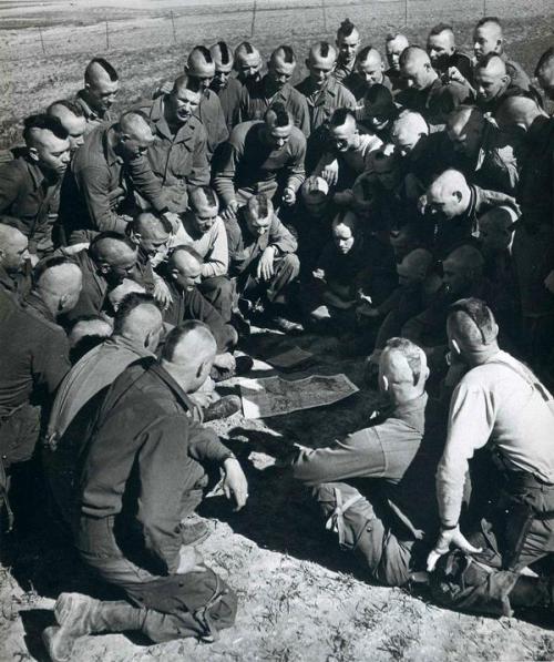 U.S. Paratroopers are briefed for the next day&rsquo;s jump across the Rhine. Arras, France. 194