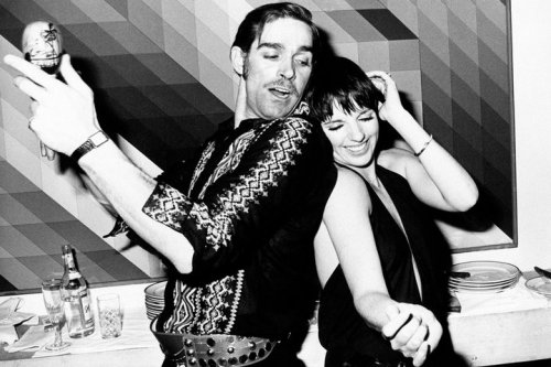 Fabio Testi playing maracas and dancing with Liza Minnelli at a party in Rome, January 1976