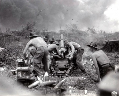 demons: Australians from the 2/4th Field Regiment, RAA of the 7th Infantry Division firing on the Ja