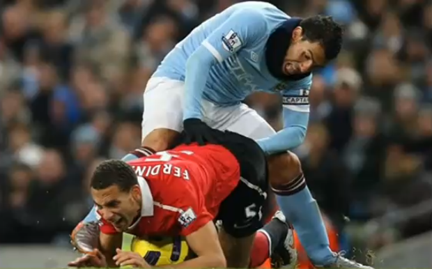 Carlos Tevez Fists Rio Ferdinand on field  This interaction on the field between