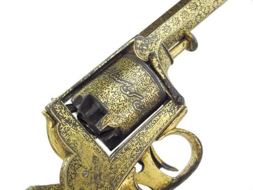 Gold koftgari decorated English Tranter Dragoon revolver, mid 19th century.from Anthony Cribb Ltd.