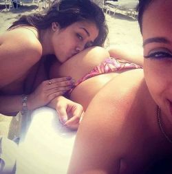 mysexysister:  Text: “Wish u were here with us bro.” My sister knew how much I loved her bootilicious ass, which is why she always would send me pics of her and her girlfriend on the beach near their summer house in Cali. She simply loved torturing