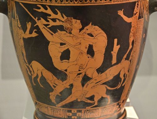 Actaeon, transforming into a deer, is torn apart by his hounds.  Apulian red-figure skyphos, ar