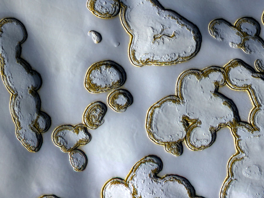 distant-traveller:  Dry ice pits on Mars  Part of Mars is defrosting. Around the South
