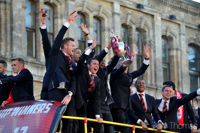 blue-madness-blue:  Cardiff City fans cheer their team on a day of sunshine celebrations
