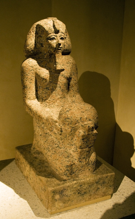 Statue of the 18th Dynasty female Pharaoh Hatshepsut (r. ca. 1478-1458 BCE), kneeling and holding a 
