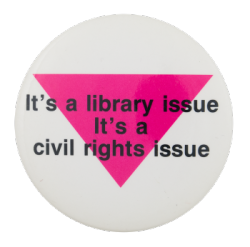 a white pin with a pink triangle and black text reading 'it's a library issue, it's a civil rights issue'