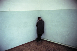 sickpage:  Thomas DworzakA mentally disabled Chechen refugee child in a shelter. Trotskoye, Ingushetia, January 2001 