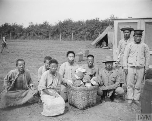 Men of the Chinese Labour Corps display the loaves of special bread they have made in their own bake